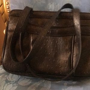 8 by 12 wide . Black ostrich  China  zipper pocket